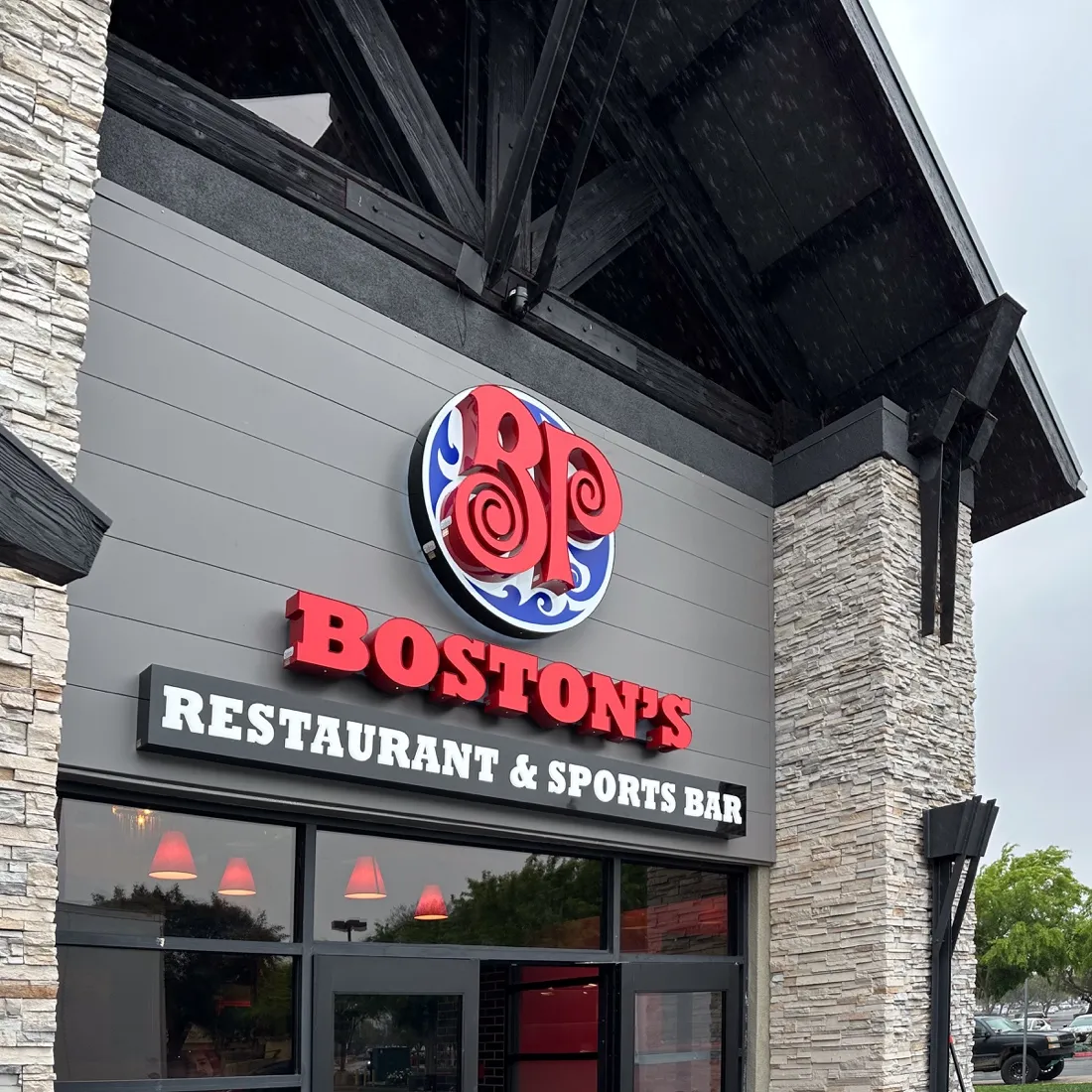 Boston's Pizza backlit and front lit channel letters at dusk, installed by VE Signs