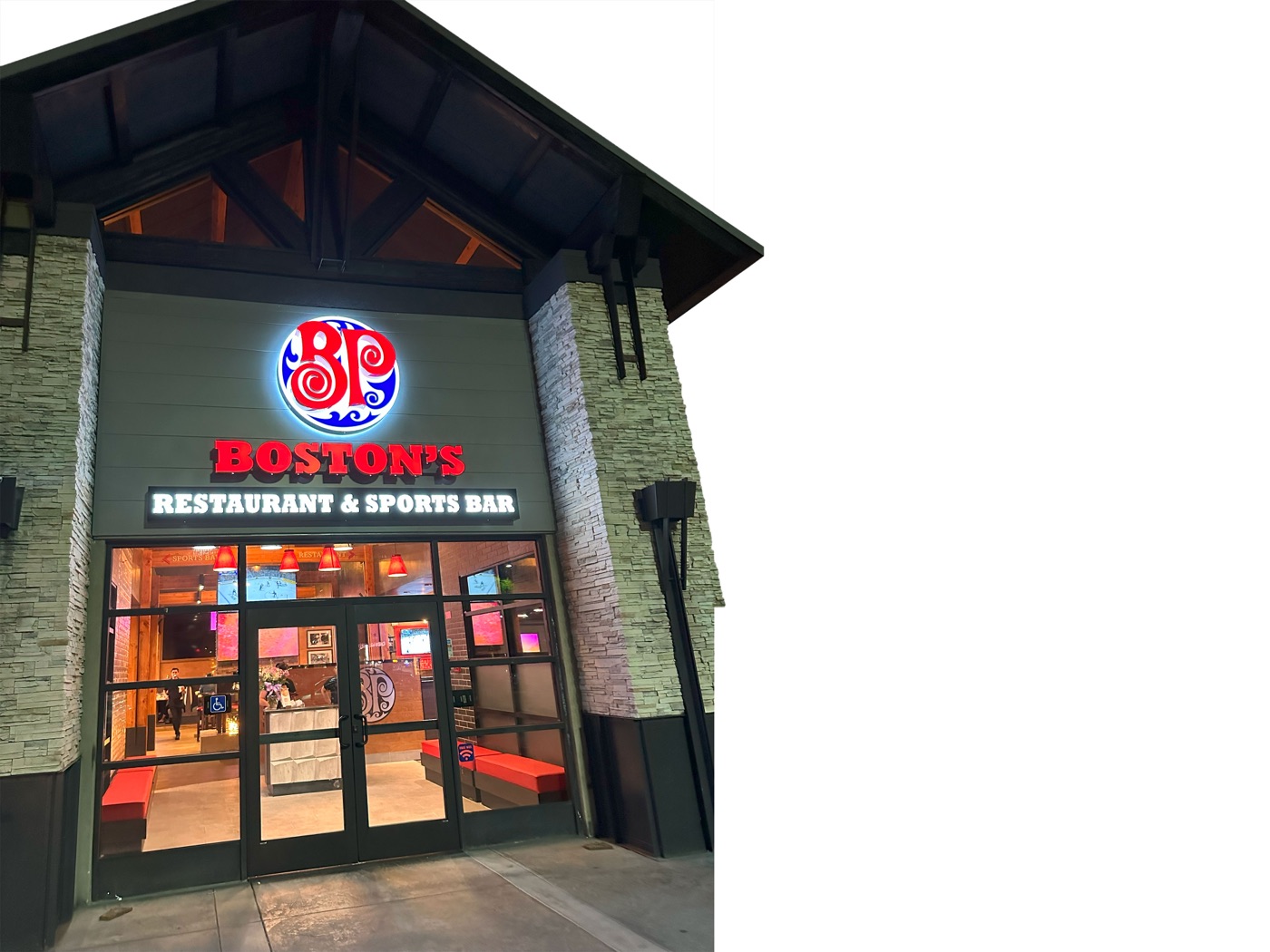 Reverse-lit channel letters glowing at dusk on a storefront installed by VE Signs